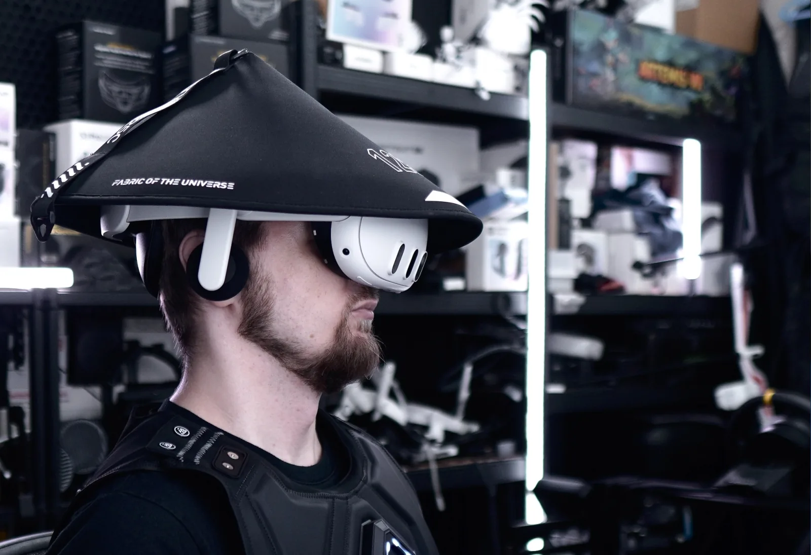 Thomas Voland wearing a VR headset and haptic vest in his studio